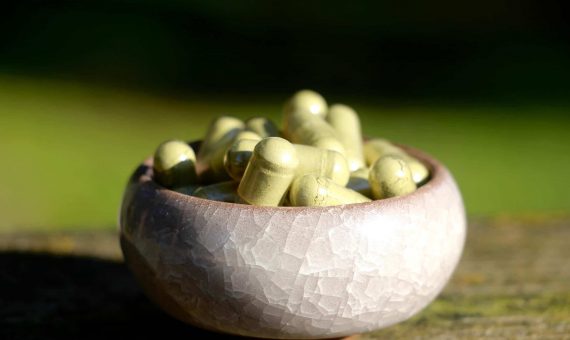 small bowl of kratom pills