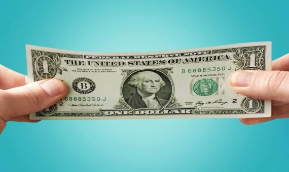 stretching dollar bill